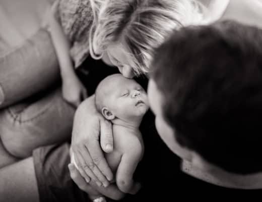 Newcastle Newborn Photography - Photo of Sophie being cradled by her parents
