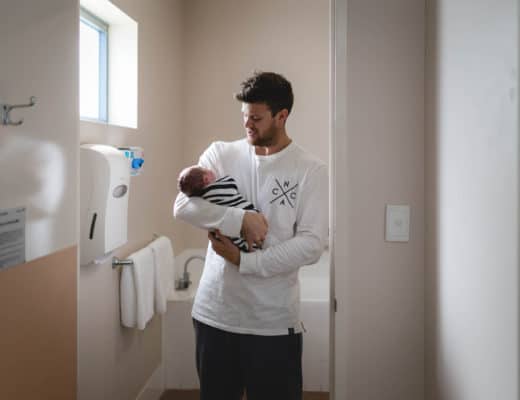Newcastle Birth Photographer | Newborn Sonny being held by his dad