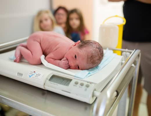 Baby being weighed after birth